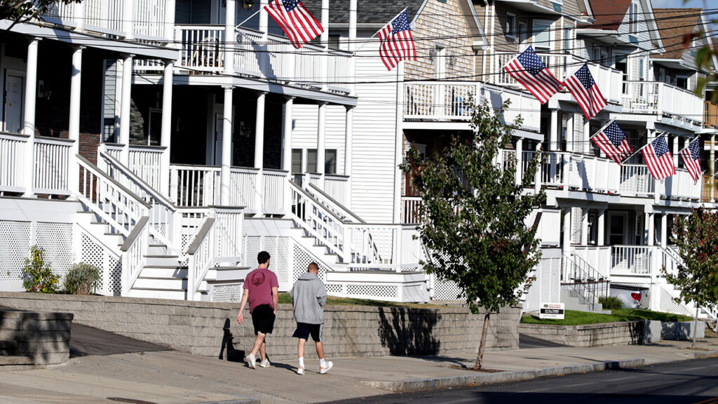 BOSTON, MA – SEPTEMBER 23: People walk down Eaton Street, where there is mostly student housing in Providence, RI on Sept. 23, 2020. 165 students from