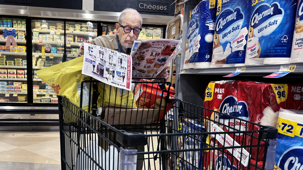 UNITED STATES – MAY 23: A shopper scans coupons in a grocery store in Washington, D.C., on Thursday, May 23, 2024. (Tom Williams/CQ-Roll Call, Inc via
