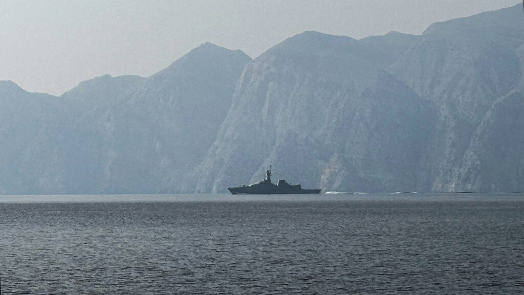 A navy vessel is seen sailing in the Strait of Hormuz, a vital waterway through which much of the world’s oil and gas passes on March 1, 2026. Two ships